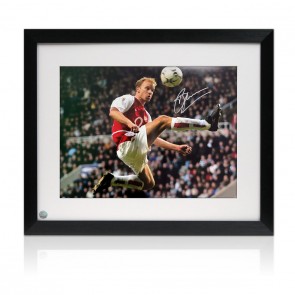  Dennis Bergkamp Signed Arsenal Football Photo: The Statue. Framed