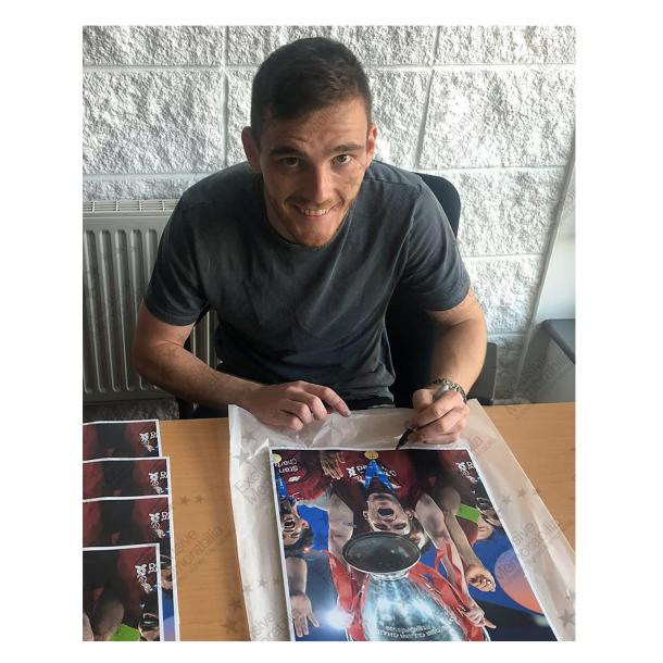 Win an Andy Robertson signed photo!