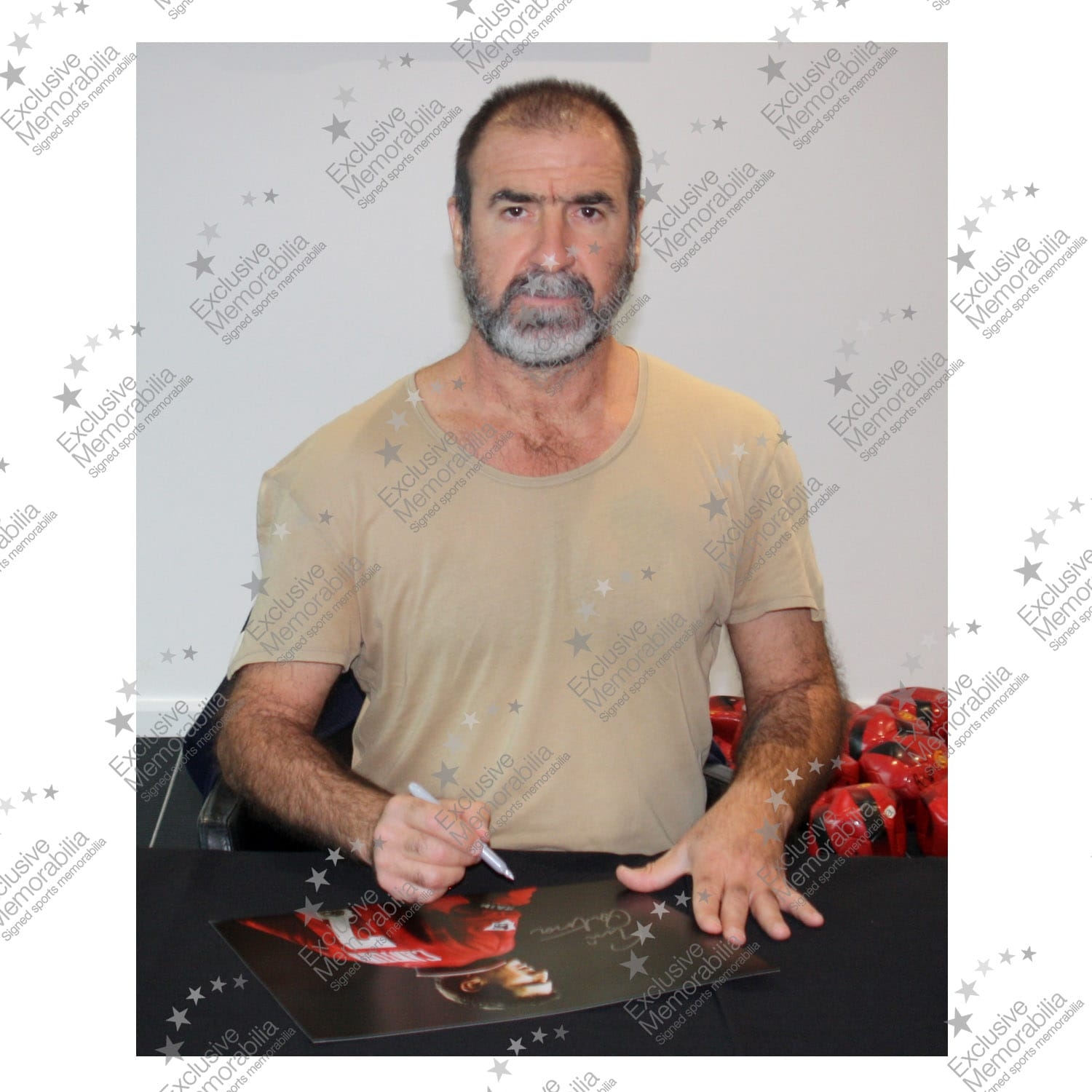 Eric Cantona signing for Exclusive Memorabilia 