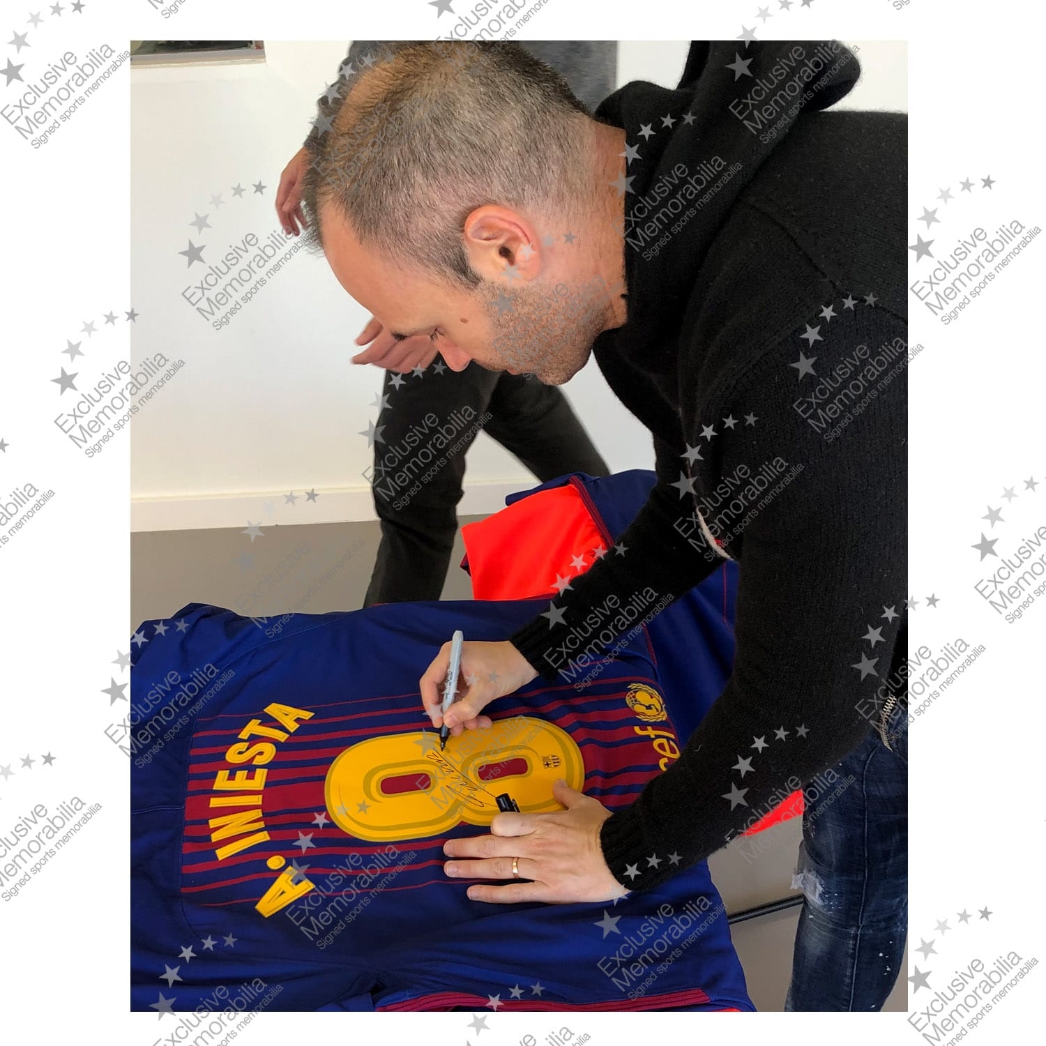 Andres Iniesta signing for Exclusive Memorabilia 